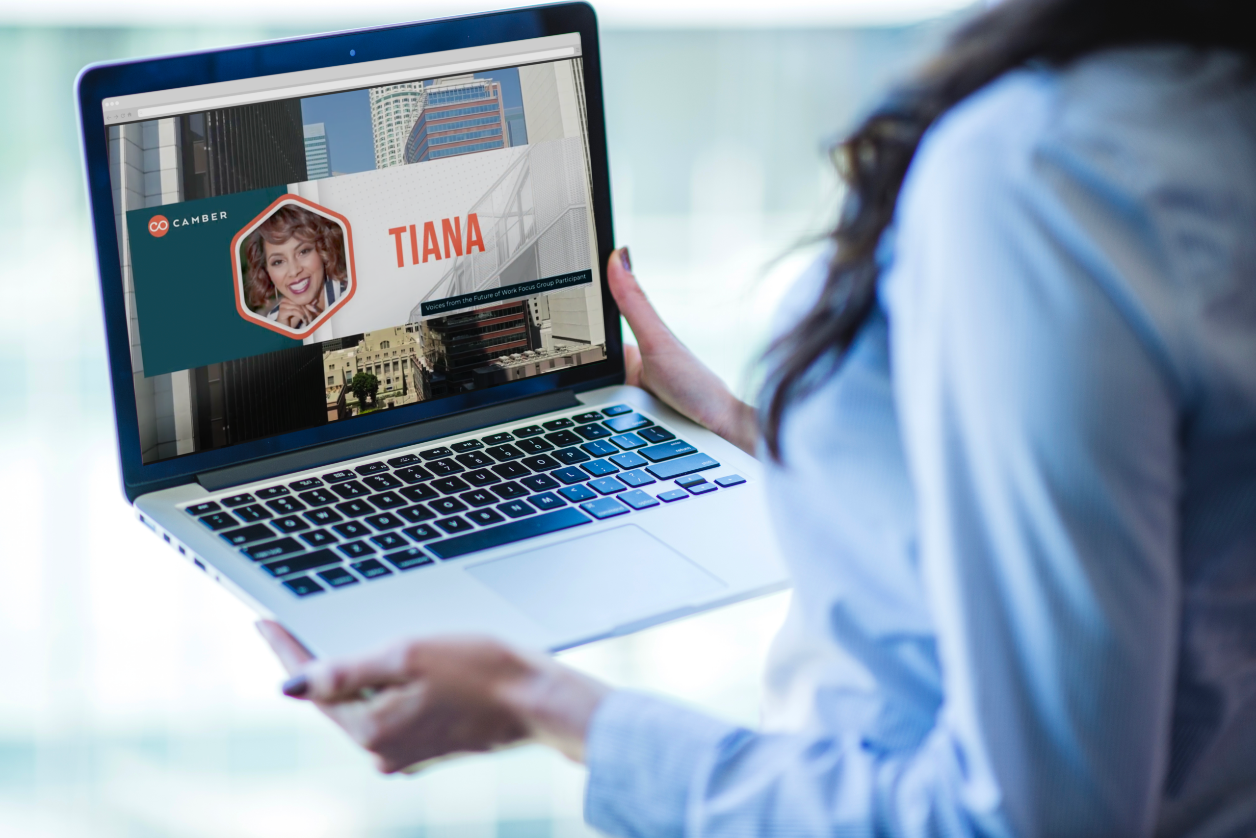 Woman viewing Camber Outdoors video portfolio on laptop
